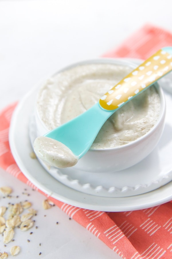 Bowl filled with homemade oat cereal for baby.