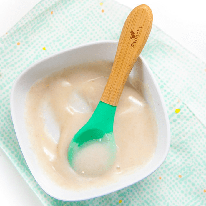 Small bowl of homemade rice puree for baby.