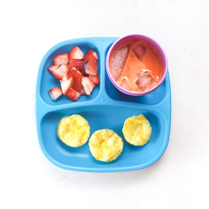 egg cups with fruit and juice for breakfast