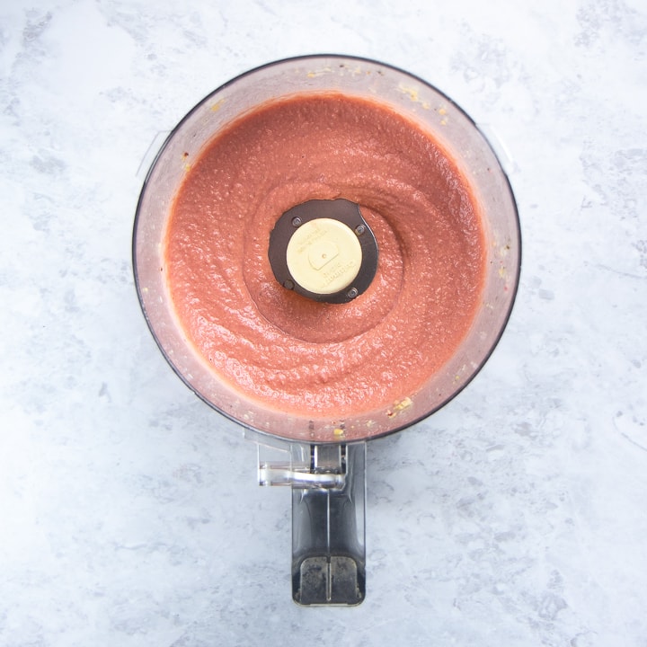 food processor filled with beet hummus