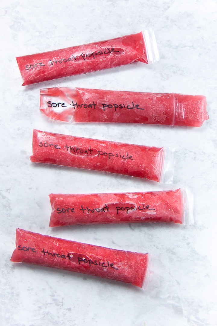 Popsicles scattered on a backdrop.