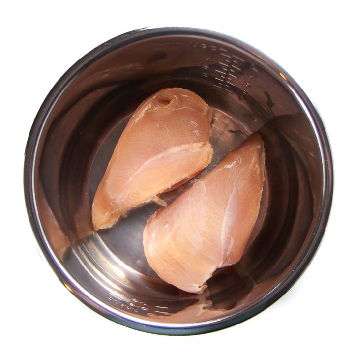 numbered Chicken breasts in an instant pot ready to get salsa on them for taco night.