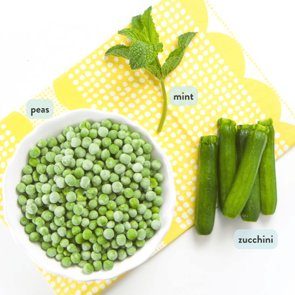 ingredients for pea puree resting on a yellow napkin on a white countertop.