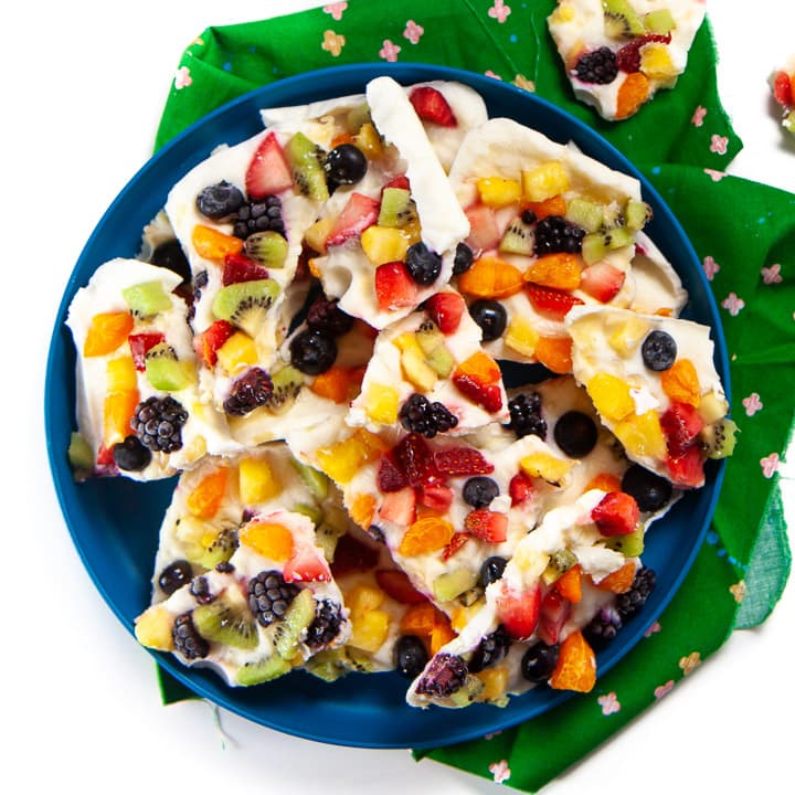 Rainbow yogurt bark on a plate ready for toddler and kids.