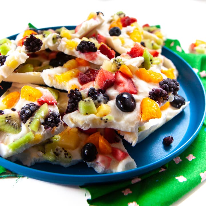Rainbow yogurt bark on a plate ready for toddler and kids.