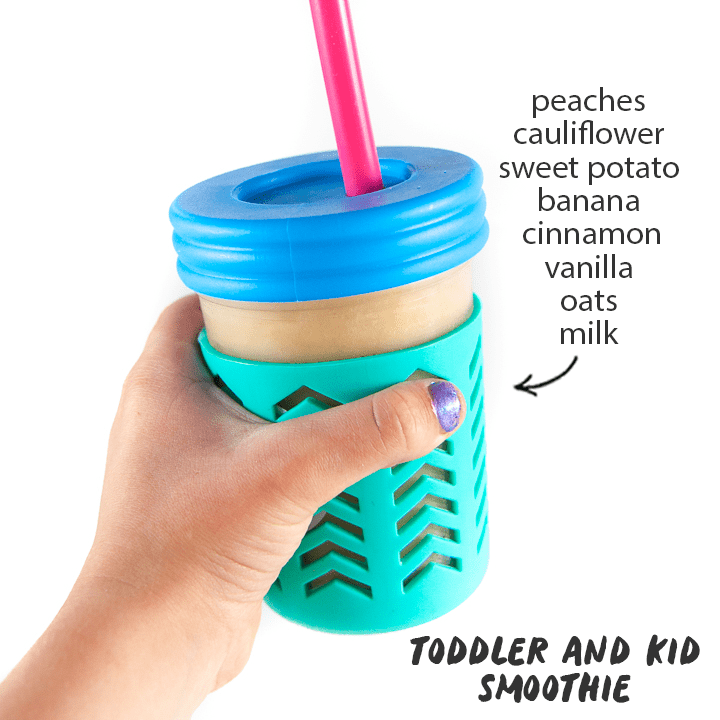 hidden veggie smoothie for kids with kids hands holding the cup with a list of healthy smoothie ingredients on the side.