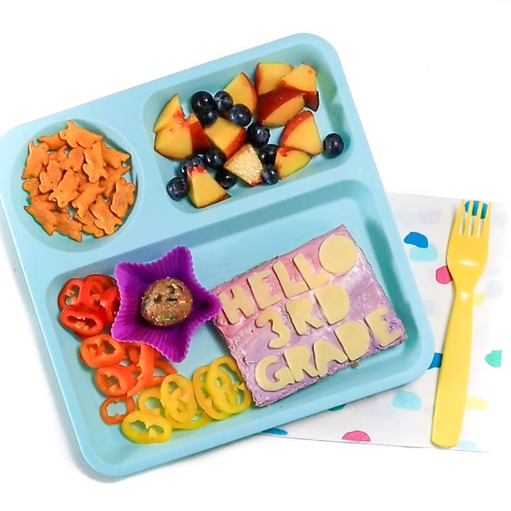 first day of school lunch for kids on a teal plate for home.