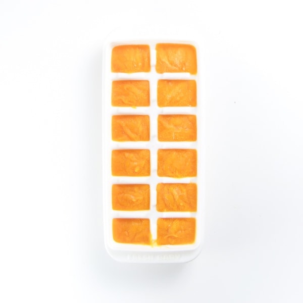 Freezer tray full of sweet potato puree.