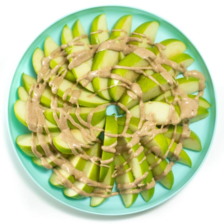 apple slices with healthy caramel sauce swirled on top.