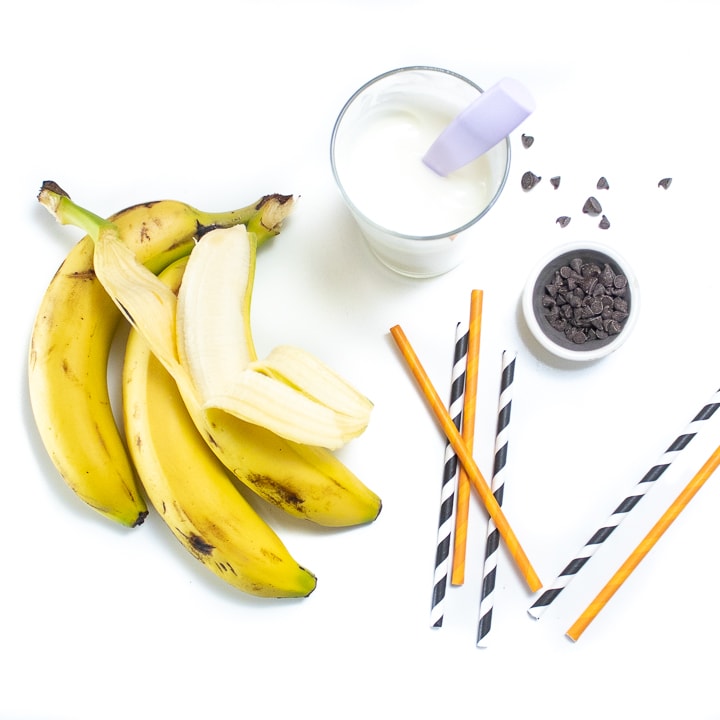 Spread of ingredients for frozen ghost bananas.
