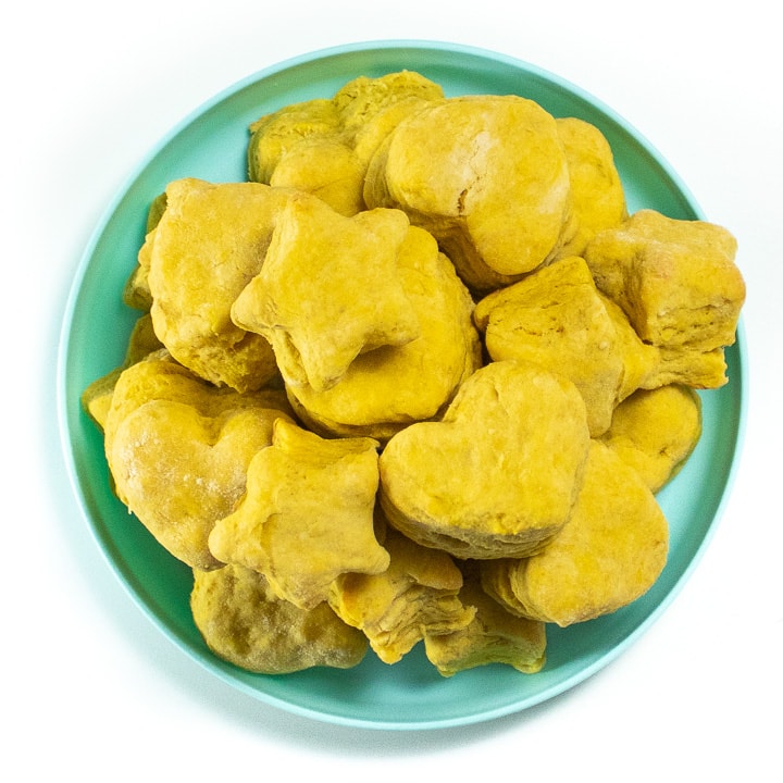 Plate full of fluffy pumpkin biscuits.