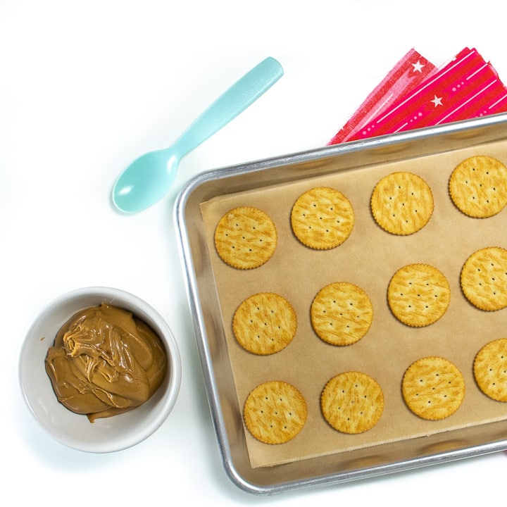 Sheet pan of ritz crackers and peanut butter.