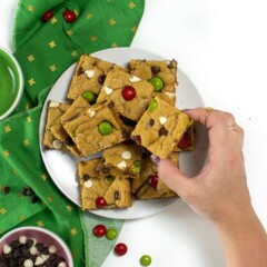 Hand reaching for cookie bar.