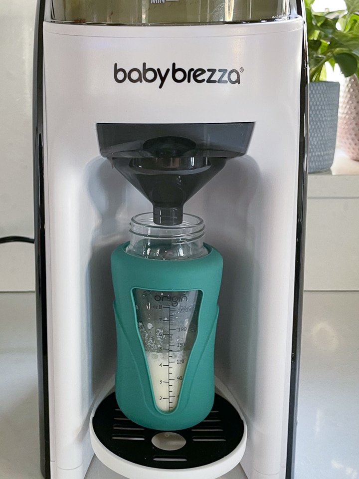Machine filling a bottle.