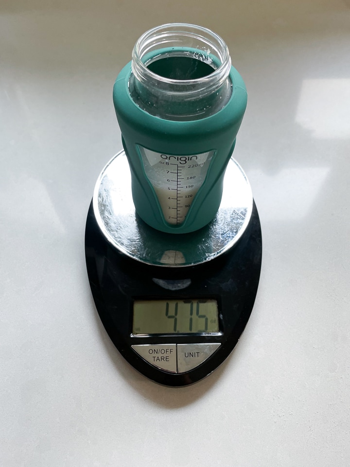 scale with a bottle on it that was made by the baby Brezza machine.