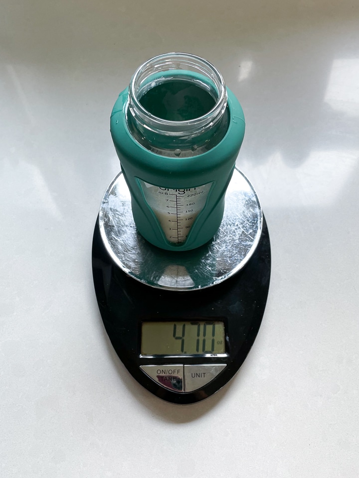 scale with a bottle on it made by hand.