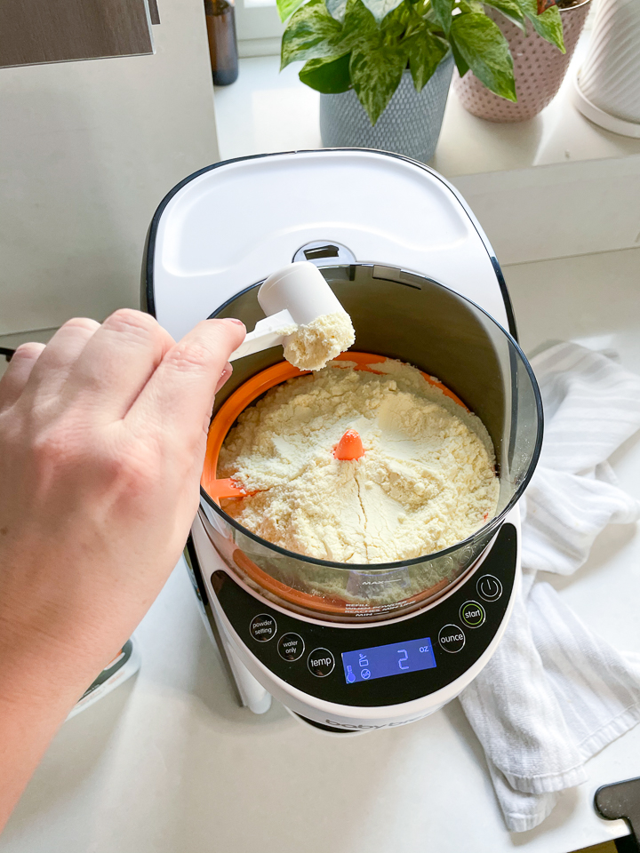 Filling the baby Brezza with formula.