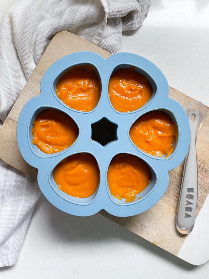 Beaba multiportions filled with sweet potato puree.