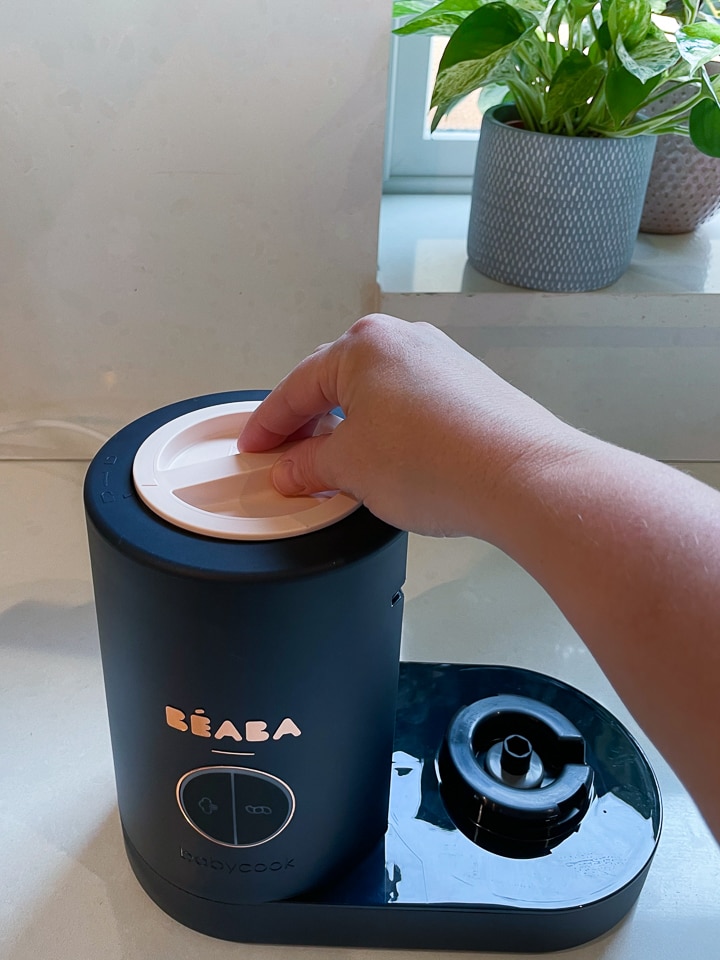 Hand locking the lid in place.