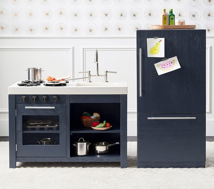 Dark charcoal playset against a white and gold wall.
