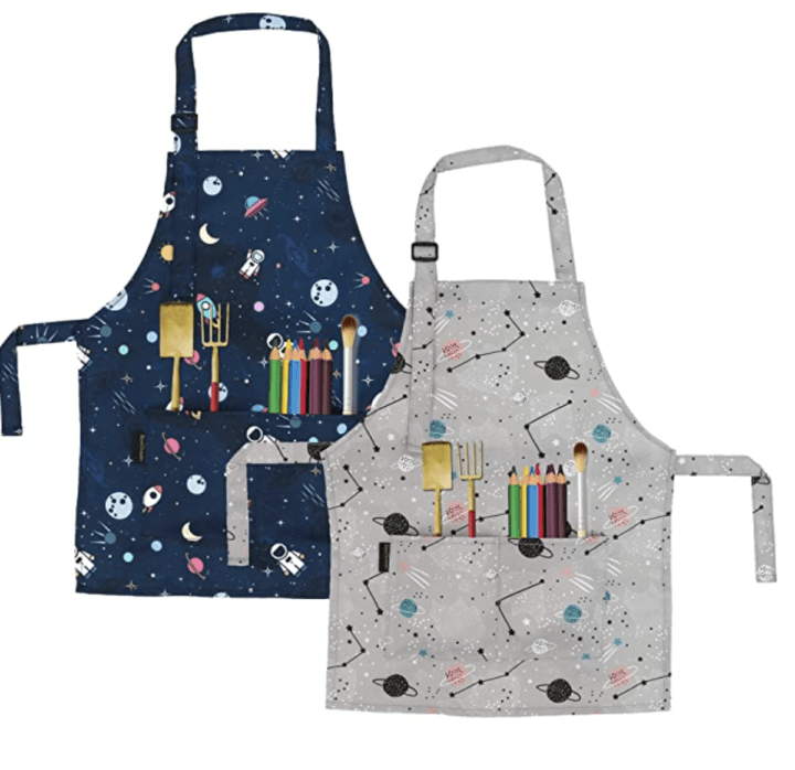 2 pack of aprons for kids with fun patterns on them.