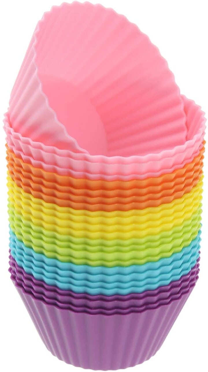 stack of rainbow colored silicone cupcake holders.