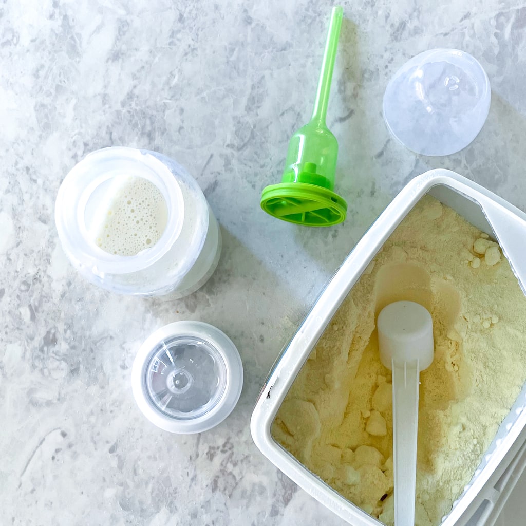 Is spread of a bottle and formula on the counter.