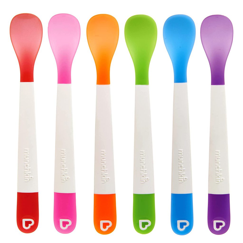 Rainbow of colors of baby spoons.