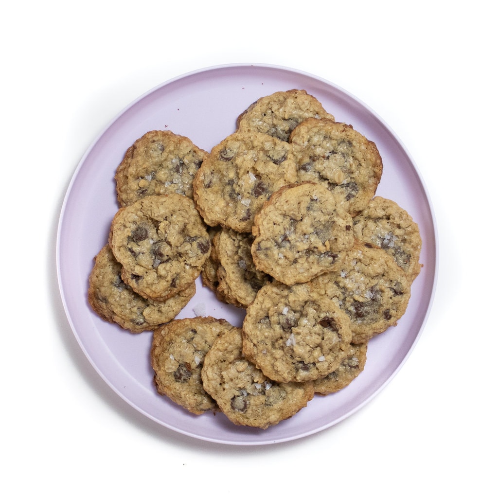 Purple plate full of chocolate chip oatmeal lactation cookies.