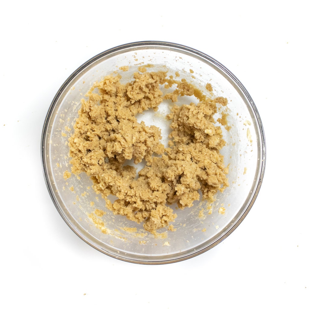 A mixing bowl with mixed butter and sugar.
