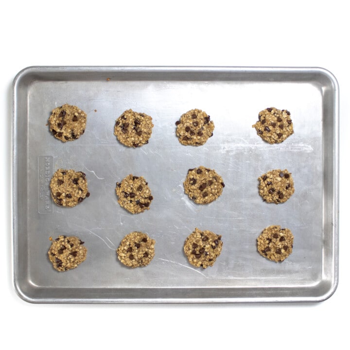 Baking sheet of 12 banana oatmeal chocolate chip cookies.