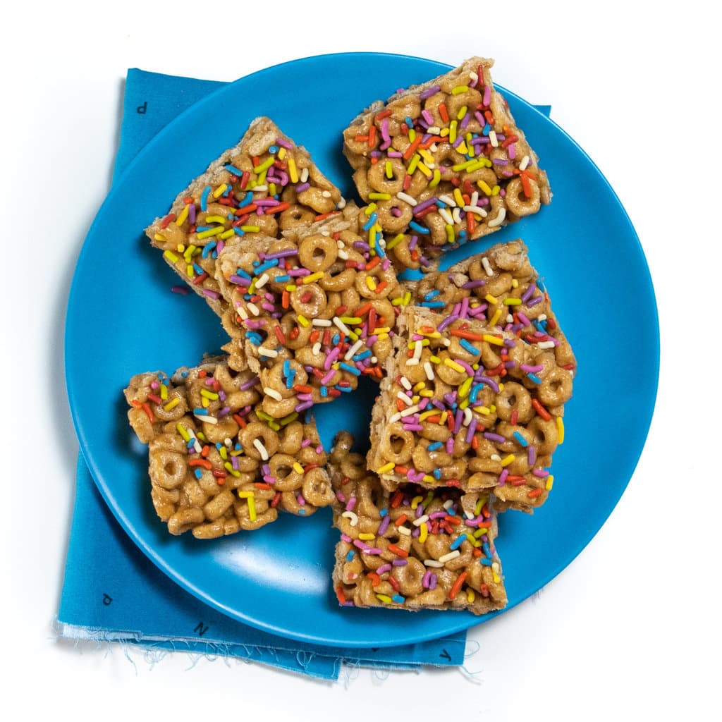 Blue kids plate bowl of cereal bars.