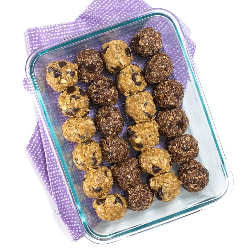 A glass container filled with two different flavors of lactation bites for new moms.