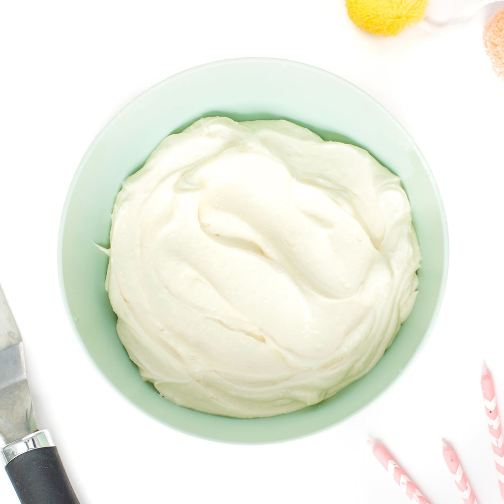 Teal bowl filled with healthy cream cheese icing.