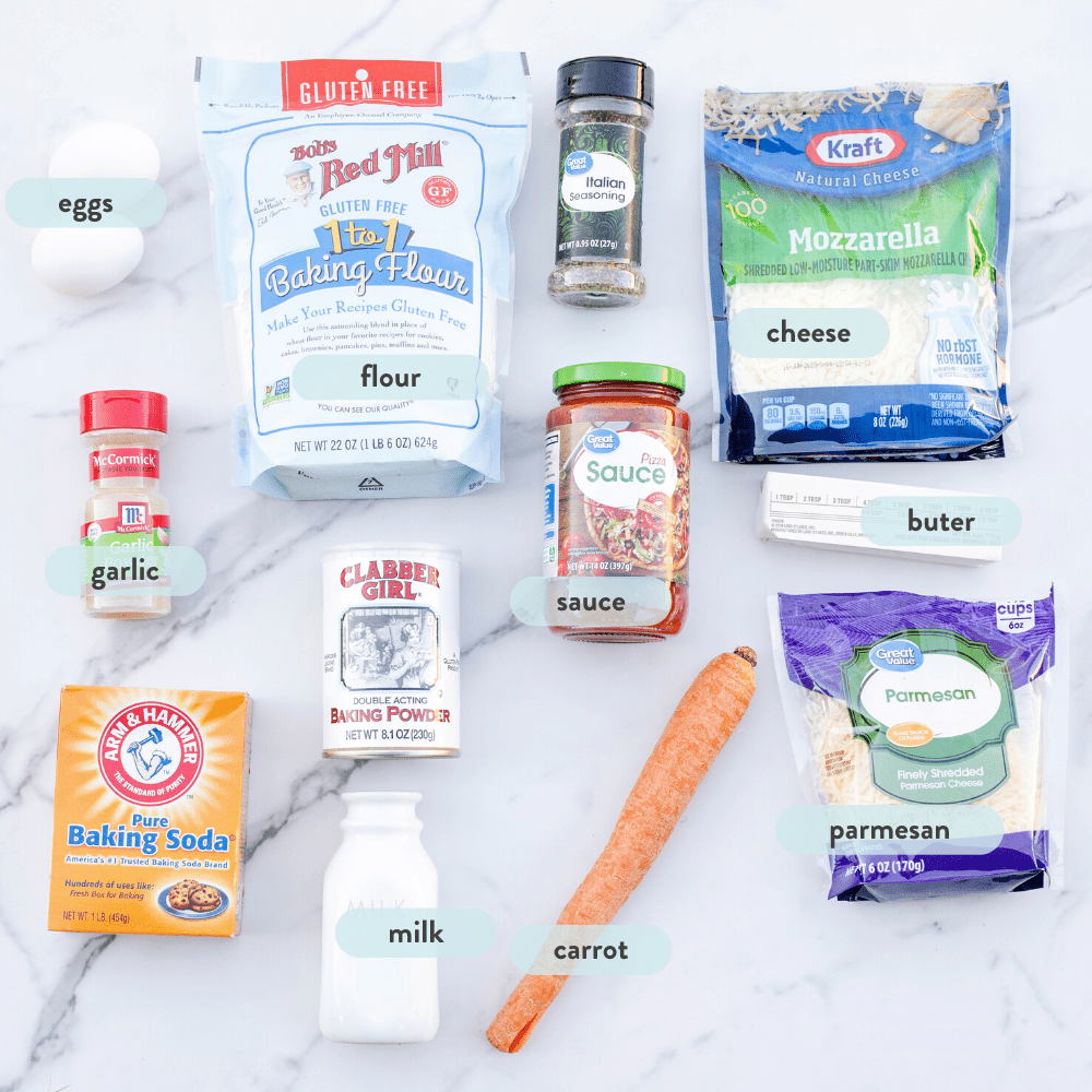 He spread on a marble countertop of all the ingredients needed for pizza muffins.