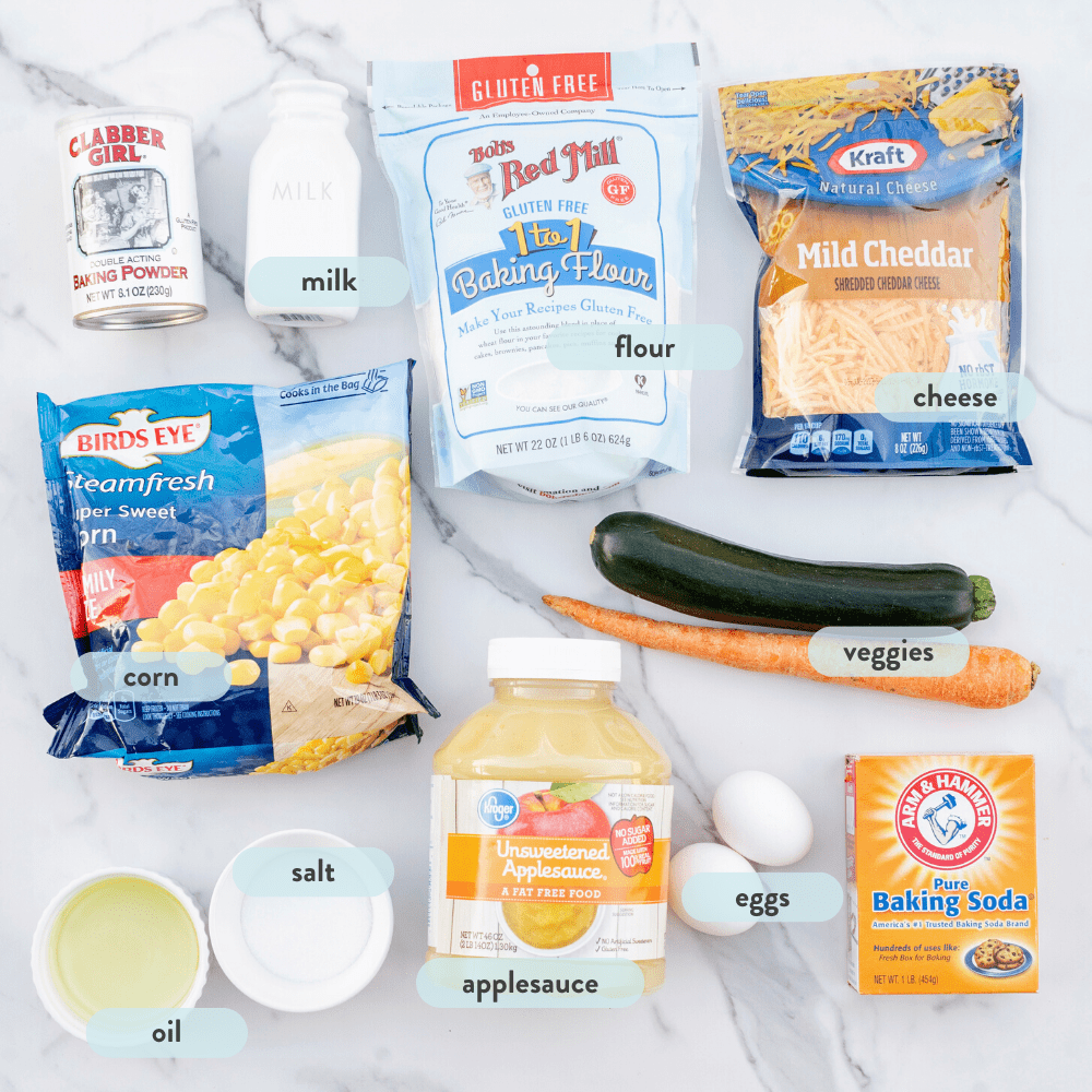 Ingredients on a marble countertop for veggie muffins.