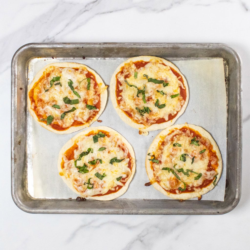 For cooked tortilla pizzas on a baking sheet.