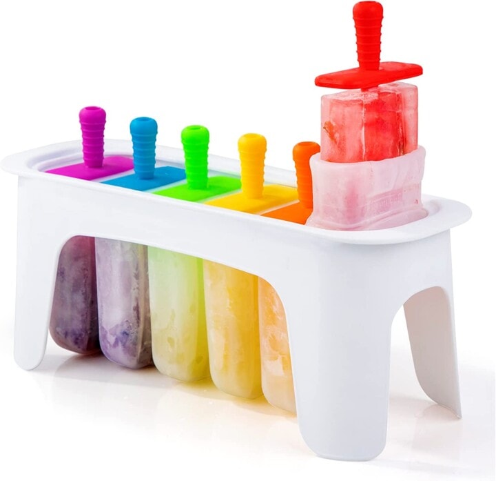 White popsicle tray with rainbow sticks.
