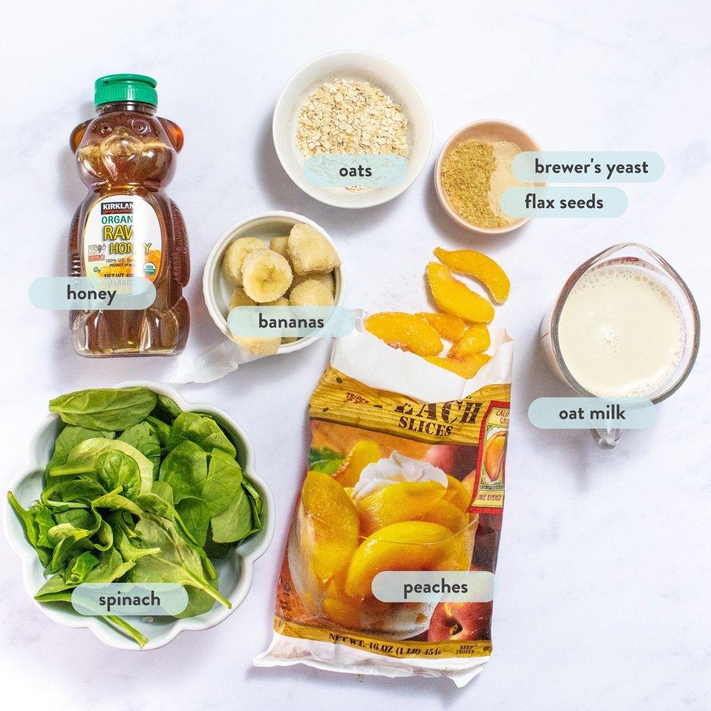 Ingredients for lactation smoothie scattered on a marble countertop.