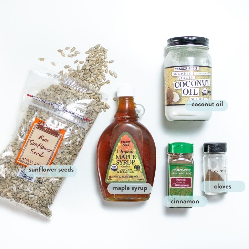 Spread of ingredients on a white background to make spiced sunflower seed butter.