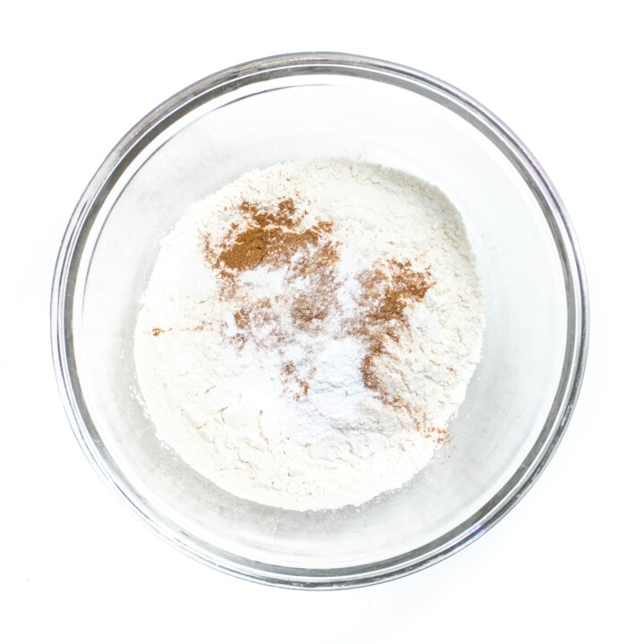 Glass mixing bowl with dry ingredients for pancakes.