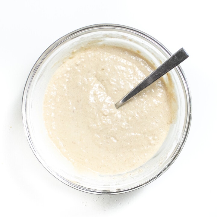 Mixing bowl on white counter with pancake batter.