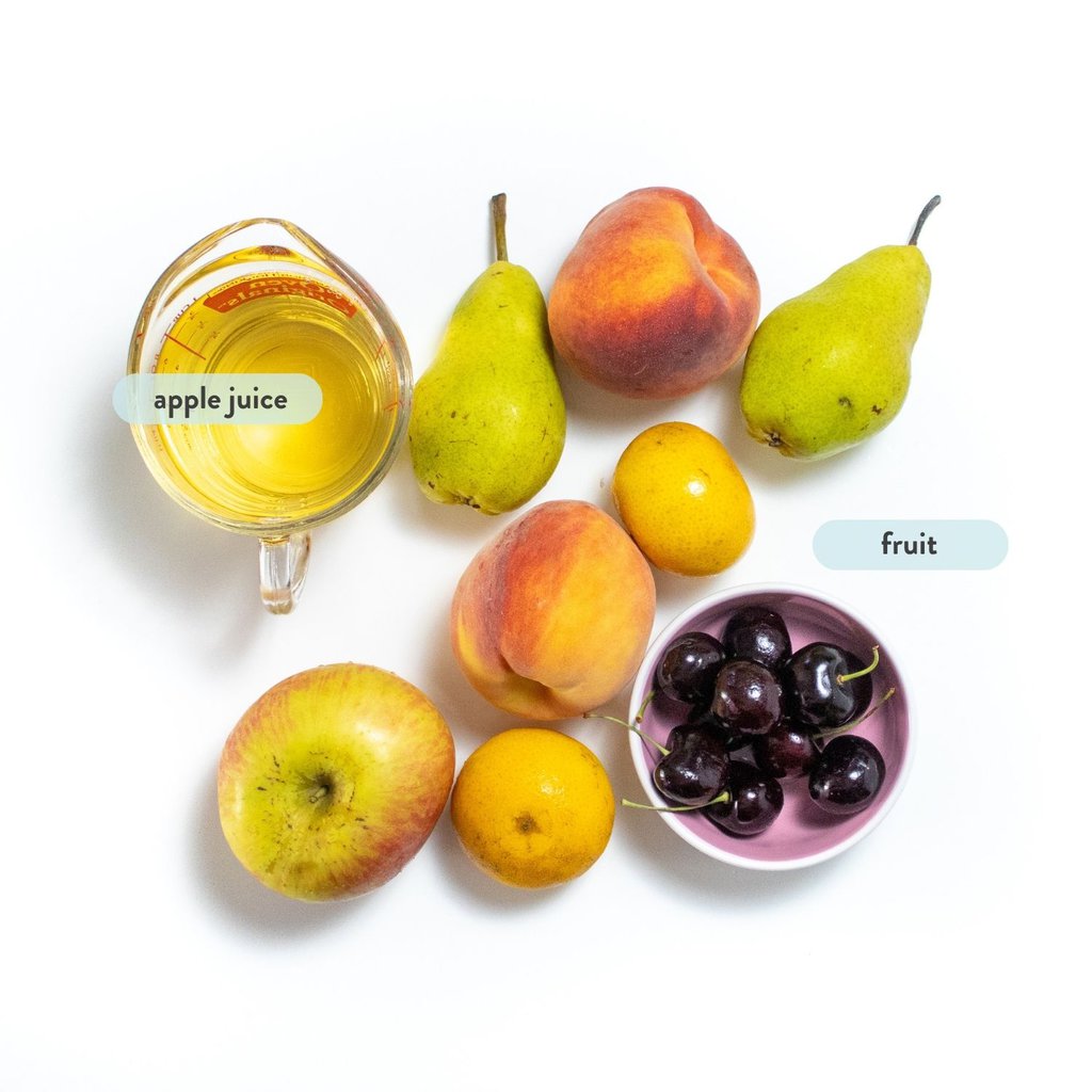 graphic for post- spread of fruit and ingredients for fruit cups on a white countertop with text next to them.