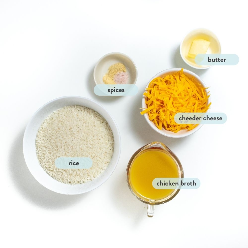 spread of ingredients for cheesy rice on a white counter with graphics of texts for each ingredient.