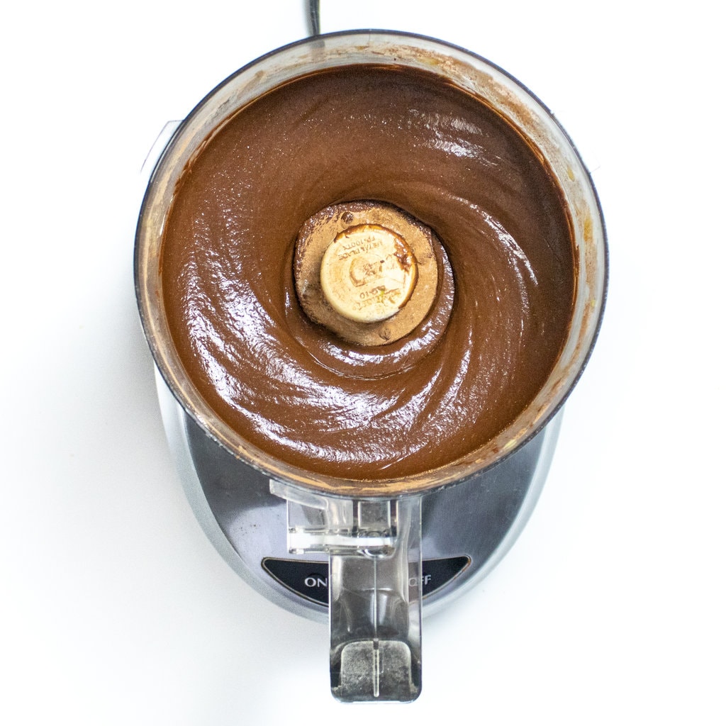 A food processor, on our way counter with batter for avocado brownies.