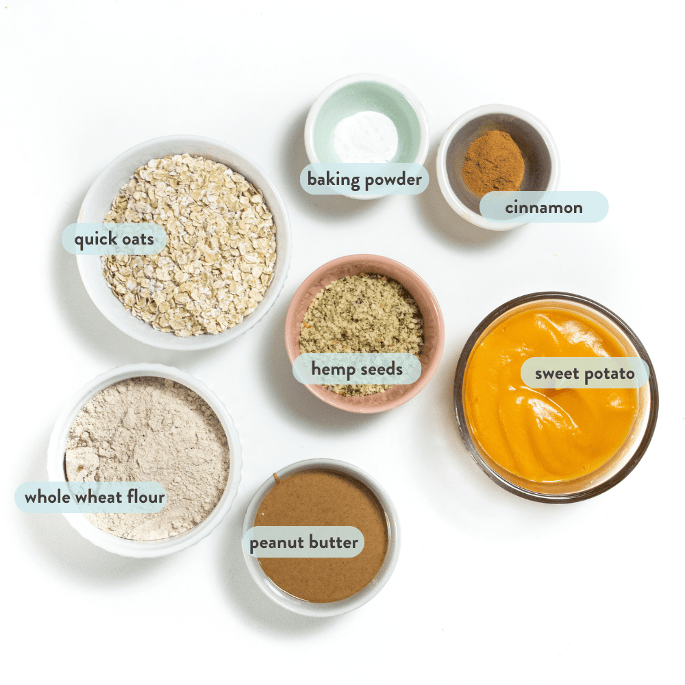 Ingredients for sweet potato, baby cookies on a white countertop with graphics labeling, which each ingredient is.