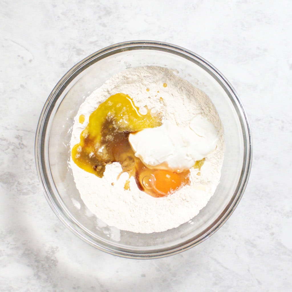Clear glass bowl with pancake ingredients sitting on my kitchen counter.